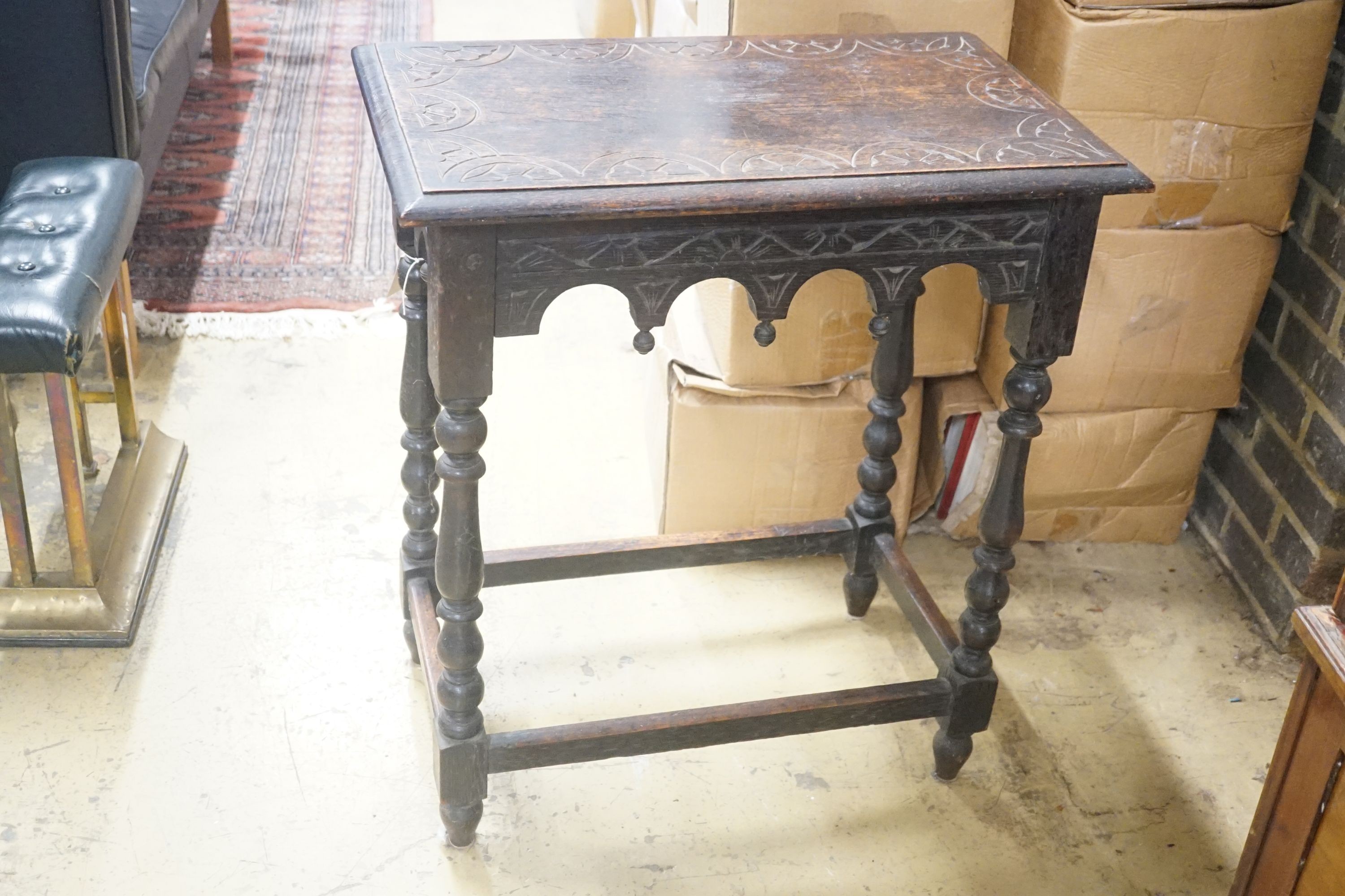 A rectangular carved oak side table, width 66cm depth 40cm height 74cm